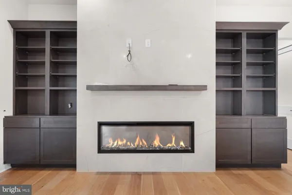a close view of kitchen sink and cabinets