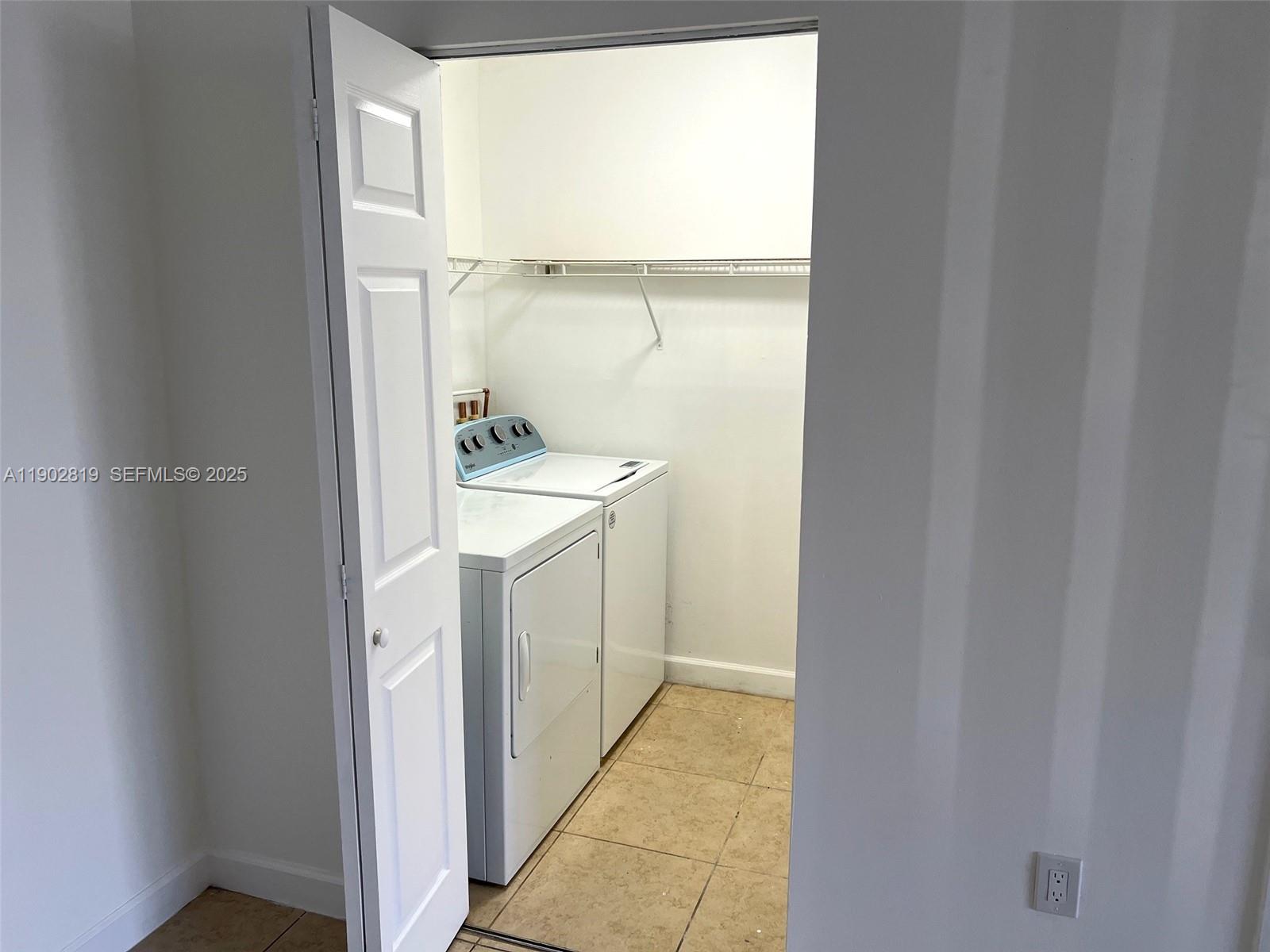 15550 Southwest 80th Street, Unit E101 Miami, FL 33193 - Photo 14 of 21 a bathroom with a sink and mirror