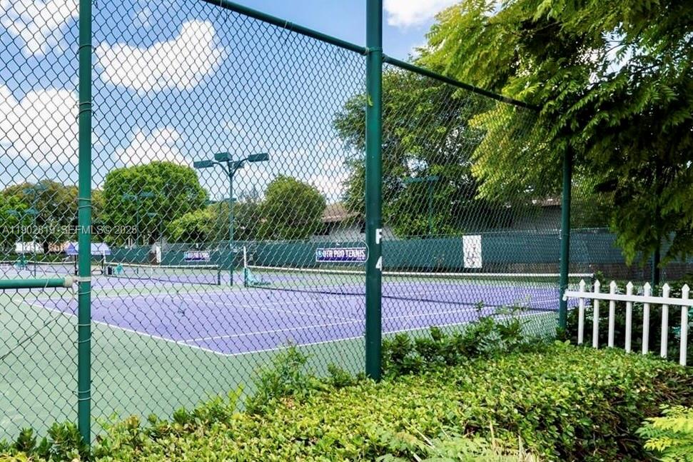 15550 Southwest 80th Street, Unit E101 Miami, FL 33193 - Photo 20 of 21 a view of a tennis court