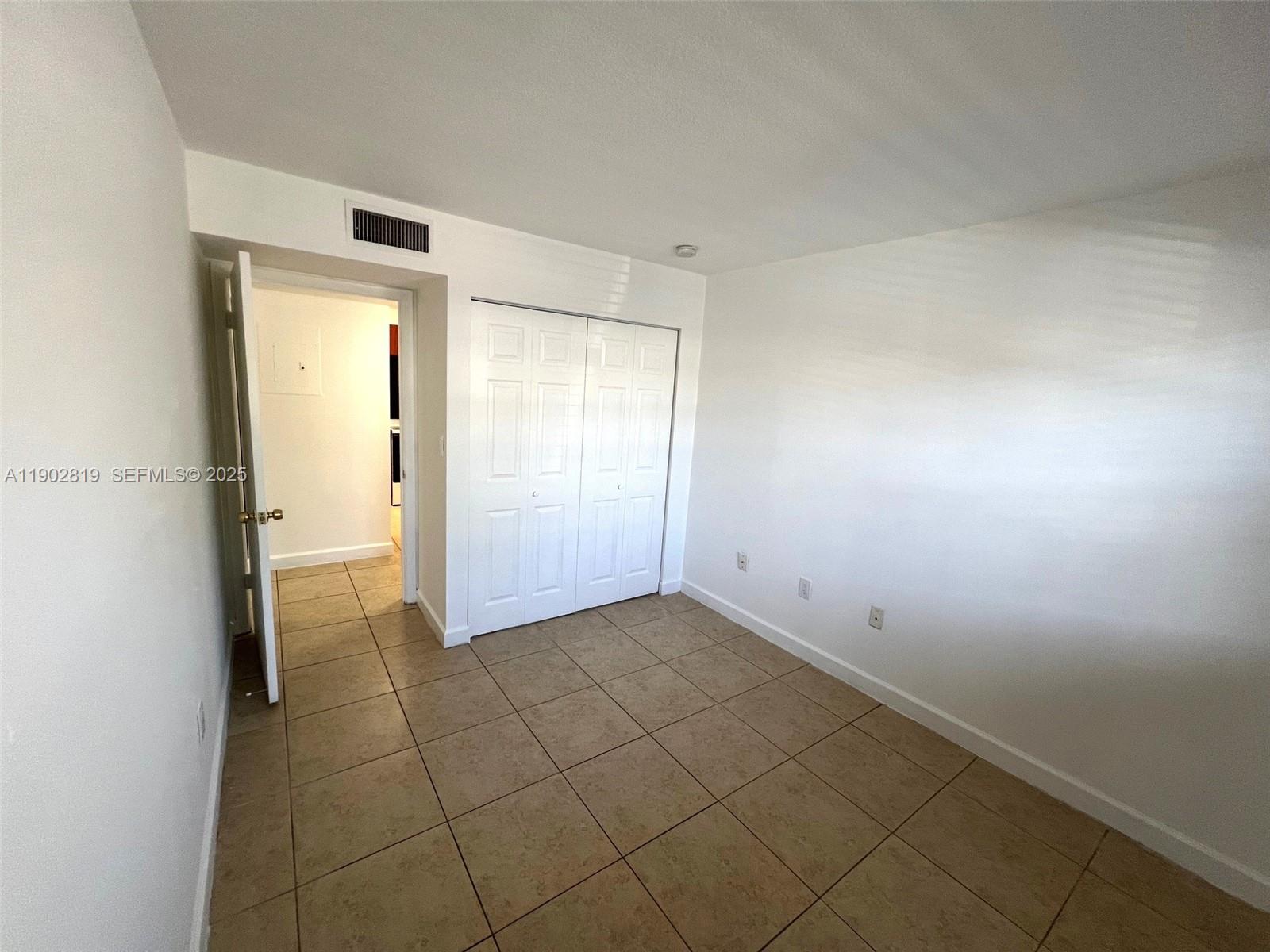 15550 Southwest 80th Street, Unit E101 Miami, FL 33193 - Photo 7 of 21 a view of an empty room