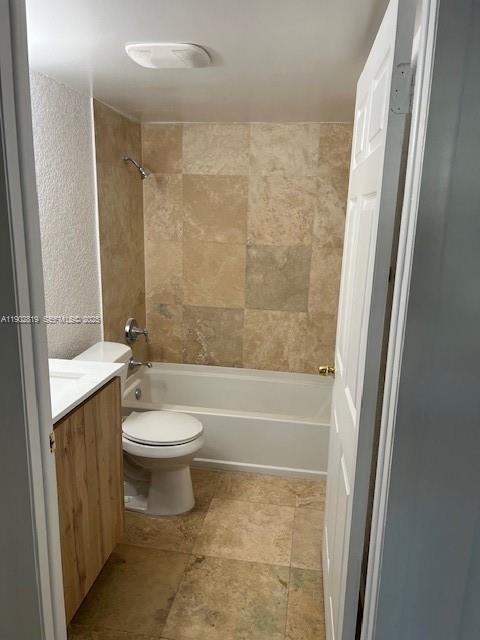 15550 Southwest 80th Street, Unit E101 Miami, FL 33193 - Photo 9 of 21 a bathroom with a toilet a sink and bathtub