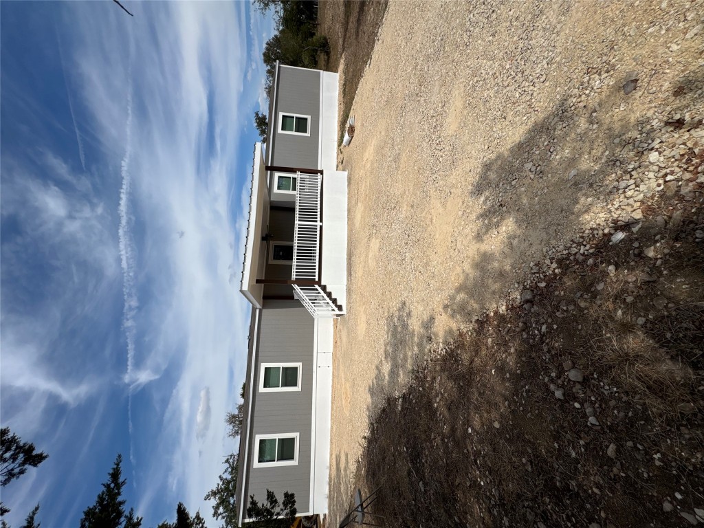 277 Elm Forest Loop, Unit B Cedar Creek, TX 78612 - Photo 1 of 26 a front view of a house with yard