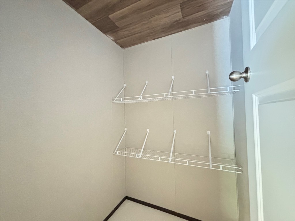 277 Elm Forest Loop, Unit B Cedar Creek, TX 78612 - Photo 19 of 26 a view of small space with racks on the wall