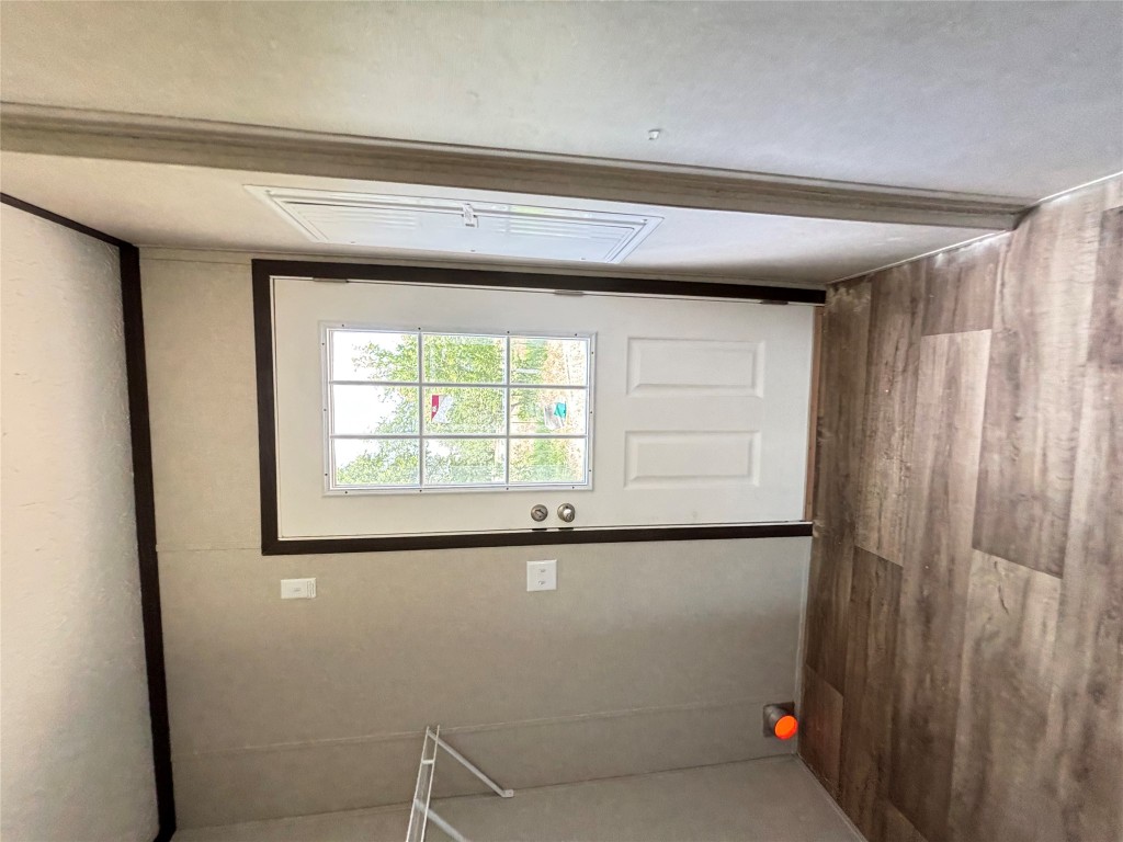 277 Elm Forest Loop, Unit B Cedar Creek, TX 78612 - Photo 21 of 26 a view of a livingroom with wooden floor and window