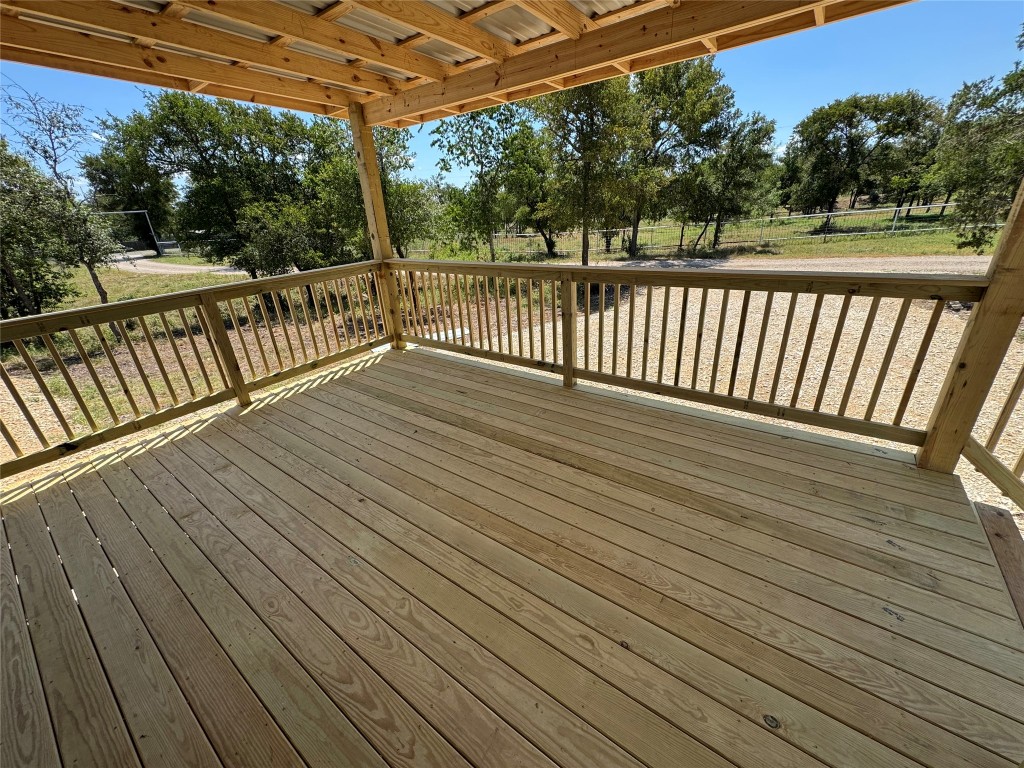 277 Elm Forest Loop, Unit B Cedar Creek, TX 78612 - Photo 23 of 26 a view of deck with wooden floor