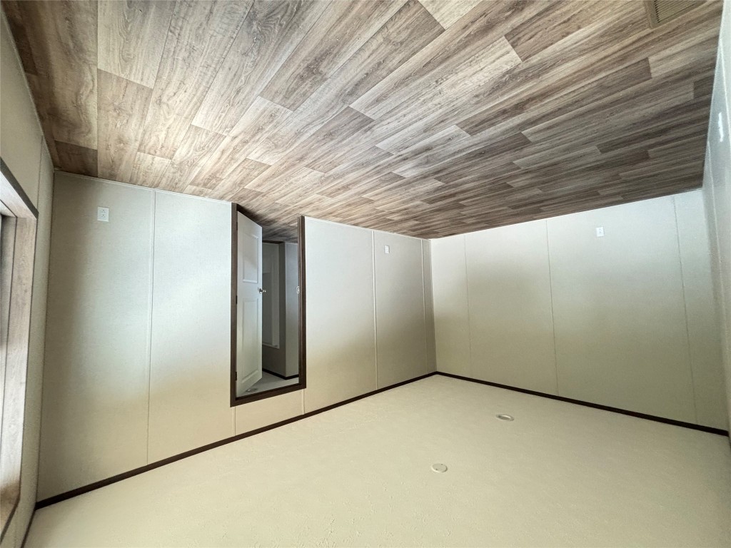 277 Elm Forest Loop, Unit B Cedar Creek, TX 78612 - Photo 8 of 26 a view of empty room with wooden floor and fan