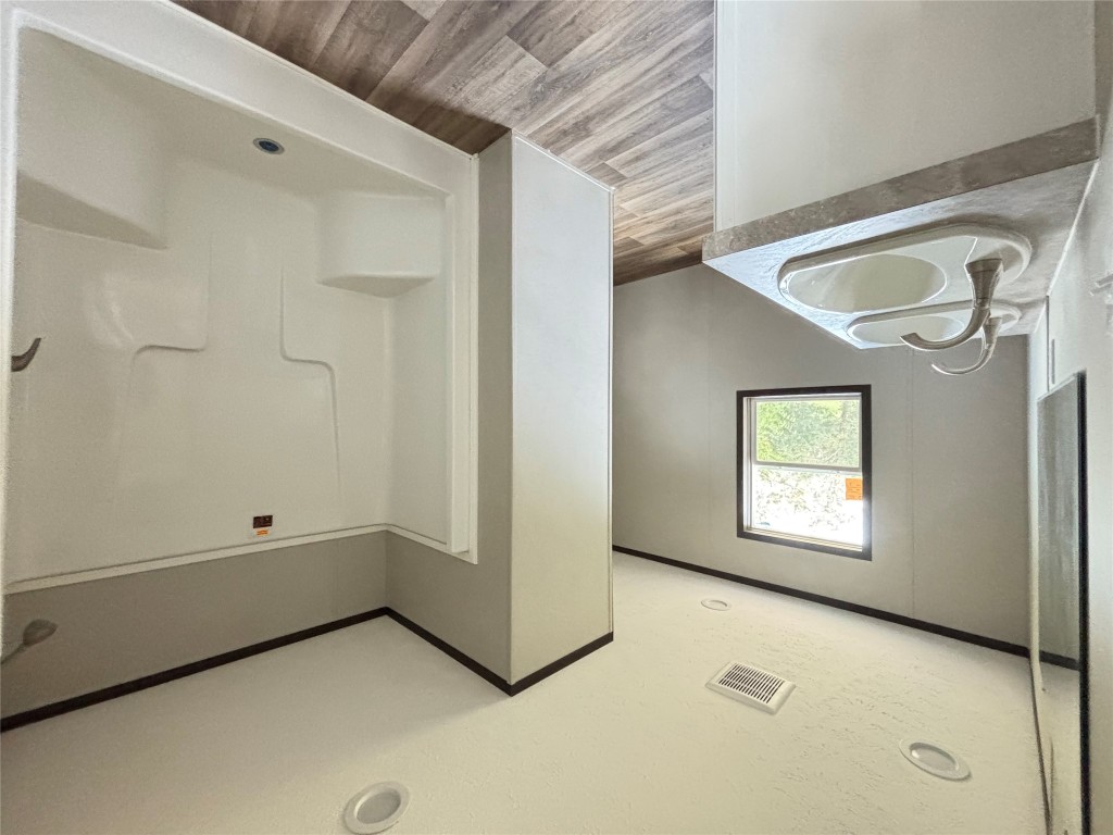 277 Elm Forest Loop, Unit B Cedar Creek, TX 78612 - Photo 9 of 26 a bathroom with a sink and a mirror