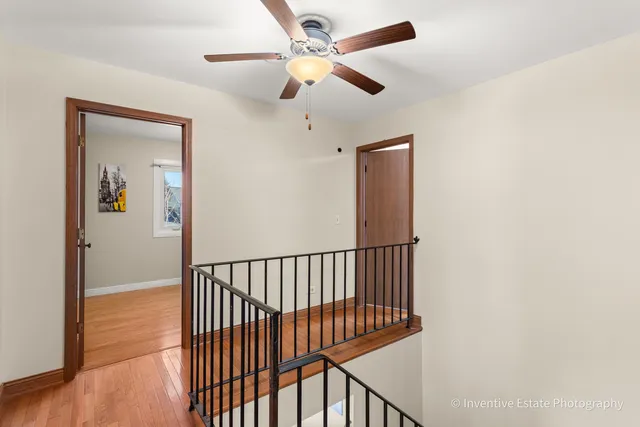 a view of staircase with wooden floor