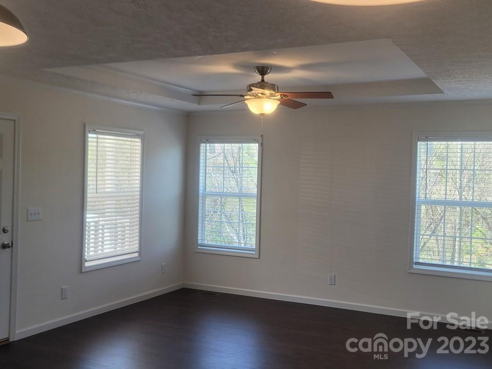 33 Hampton Heights Road Canton, NC 28716 - Photo 3 of 10 a view of a livingroom with a ceiling fan and window