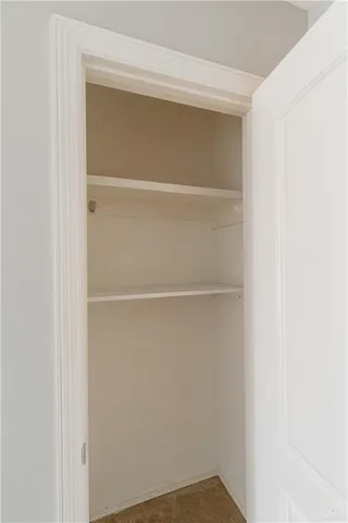 a view of an empty walk in closet