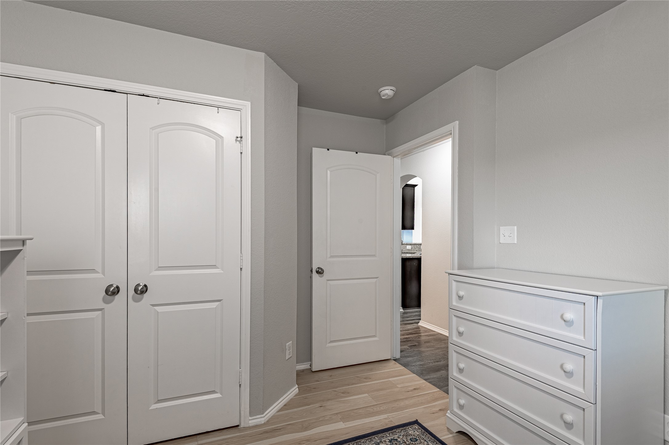 133 Bates Court Huntsville, TX 77320 - Photo 18 of 31 a view of a hallway with closet and wooden floor