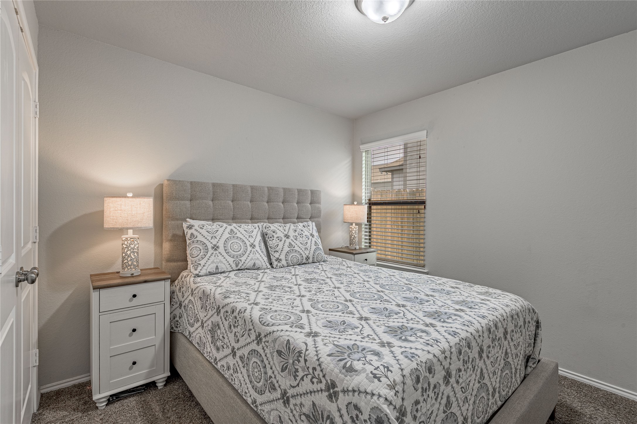 133 Bates Court Huntsville, TX 77320 - Photo 20 of 31 a bedroom with a bed and a night stand