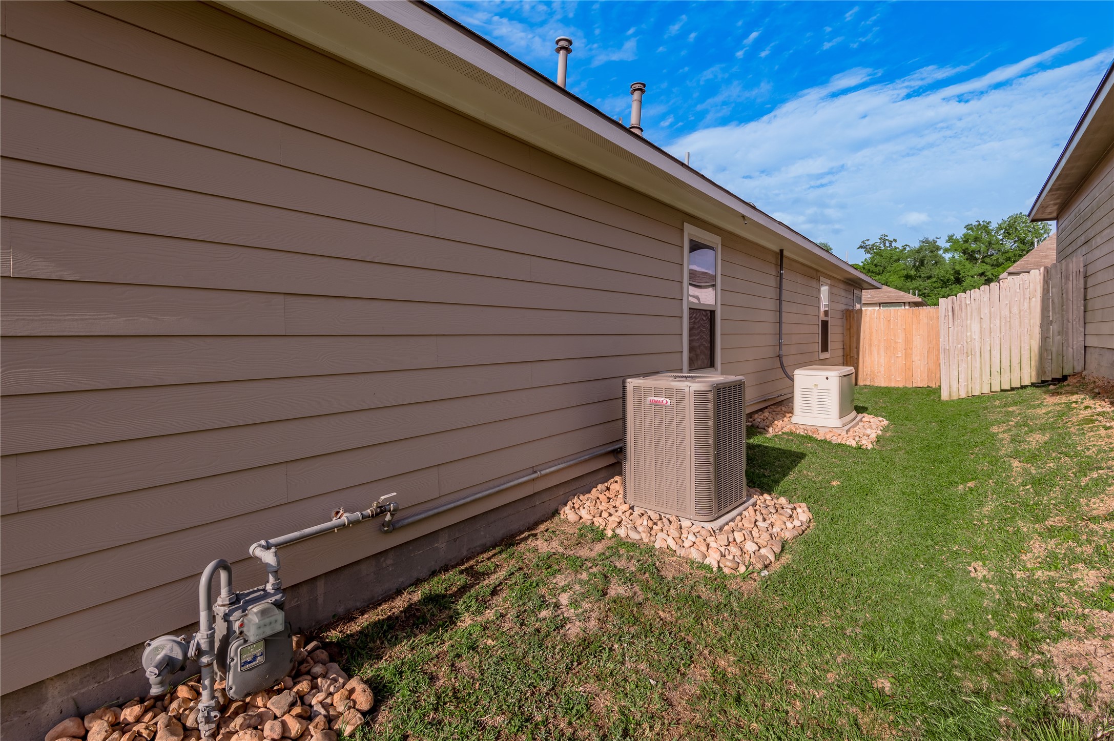 133 Bates Court Huntsville, TX 77320 - Photo 24 of 31 a view of a backyard with chairs and a small yard