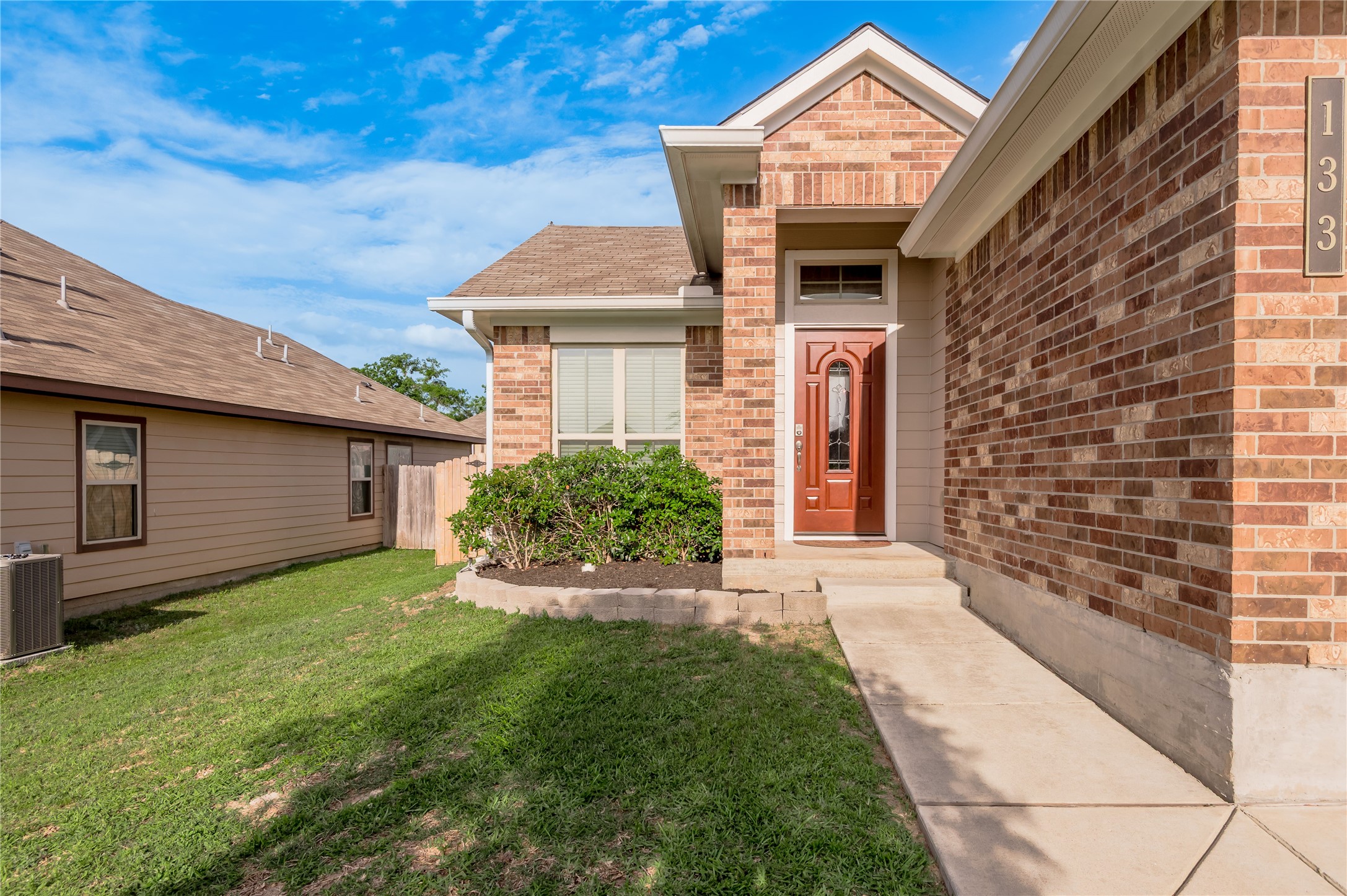 133 Bates Court Huntsville, TX 77320 - Photo 3 of 31 a front view of a house with a yard