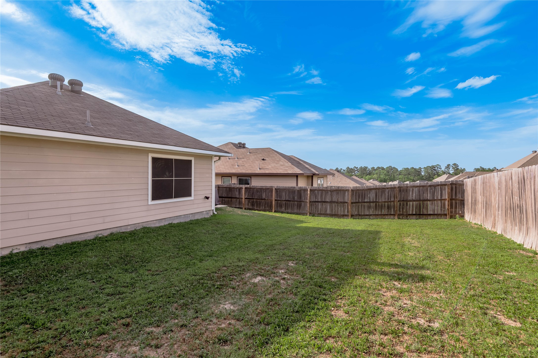 133 Bates Court Huntsville, TX 77320 - Photo 31 of 31 a view of a backyard of the house
