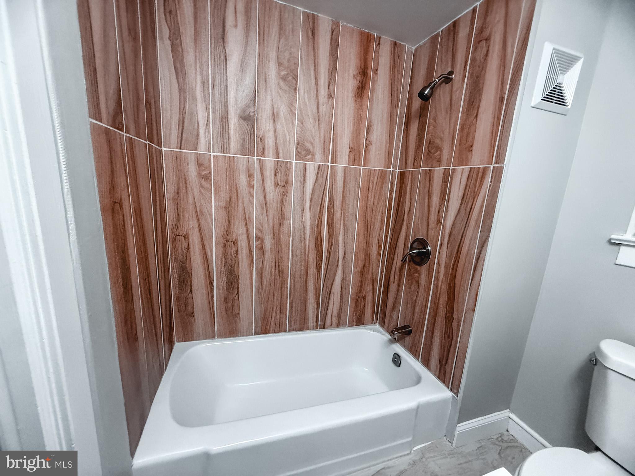 24 State Street, Unit A Penns Grove, NJ 08069 - Photo 14 of 18 a bathroom with bathtub and shower