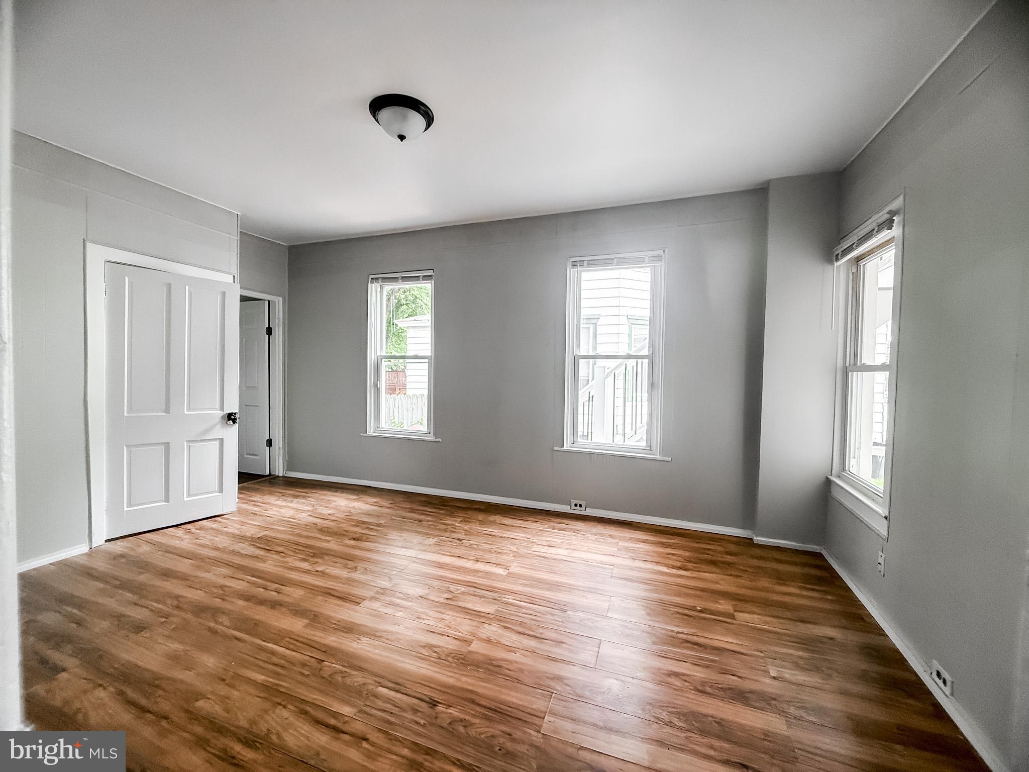 24 State Street, Unit A Penns Grove, NJ 08069 - Photo 16 of 18 a view of empty room with wooden floor and fan