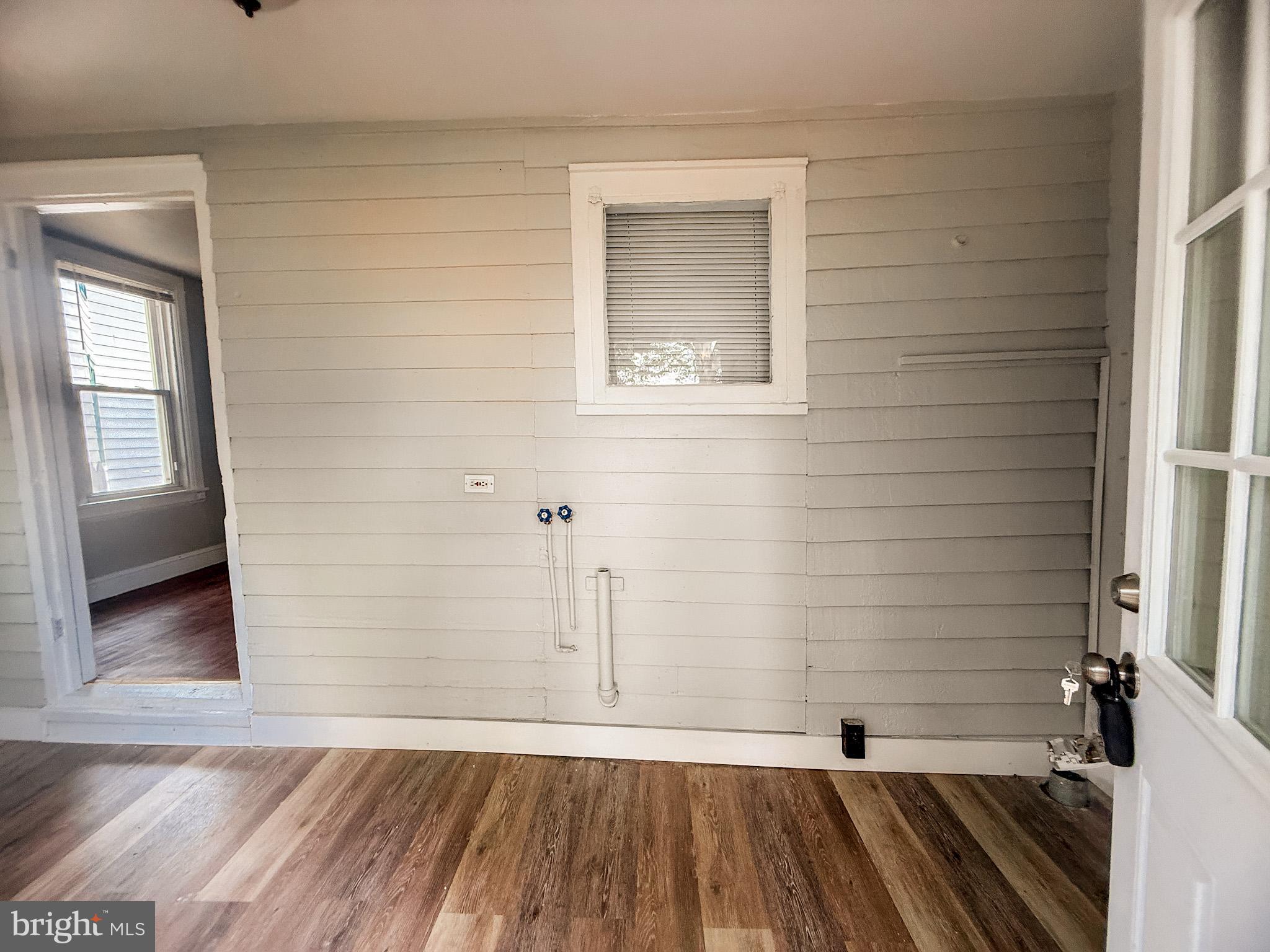 24 State Street, Unit A Penns Grove, NJ 08069 - Photo 17 of 18 a view of a room with wooden floor and a bathroom
