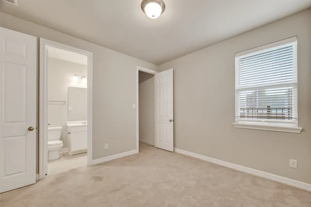 a view of a bathroom with a toilet