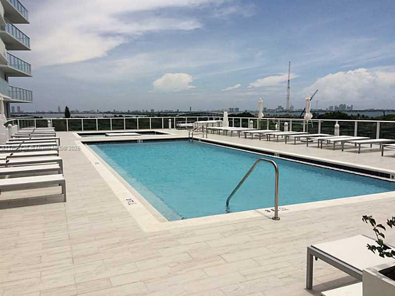 4250 Biscayne Boulevard, Unit 1104 Miami, FL 33137 - Photo 16 of 31 a view of a swimming pool and lounge chair