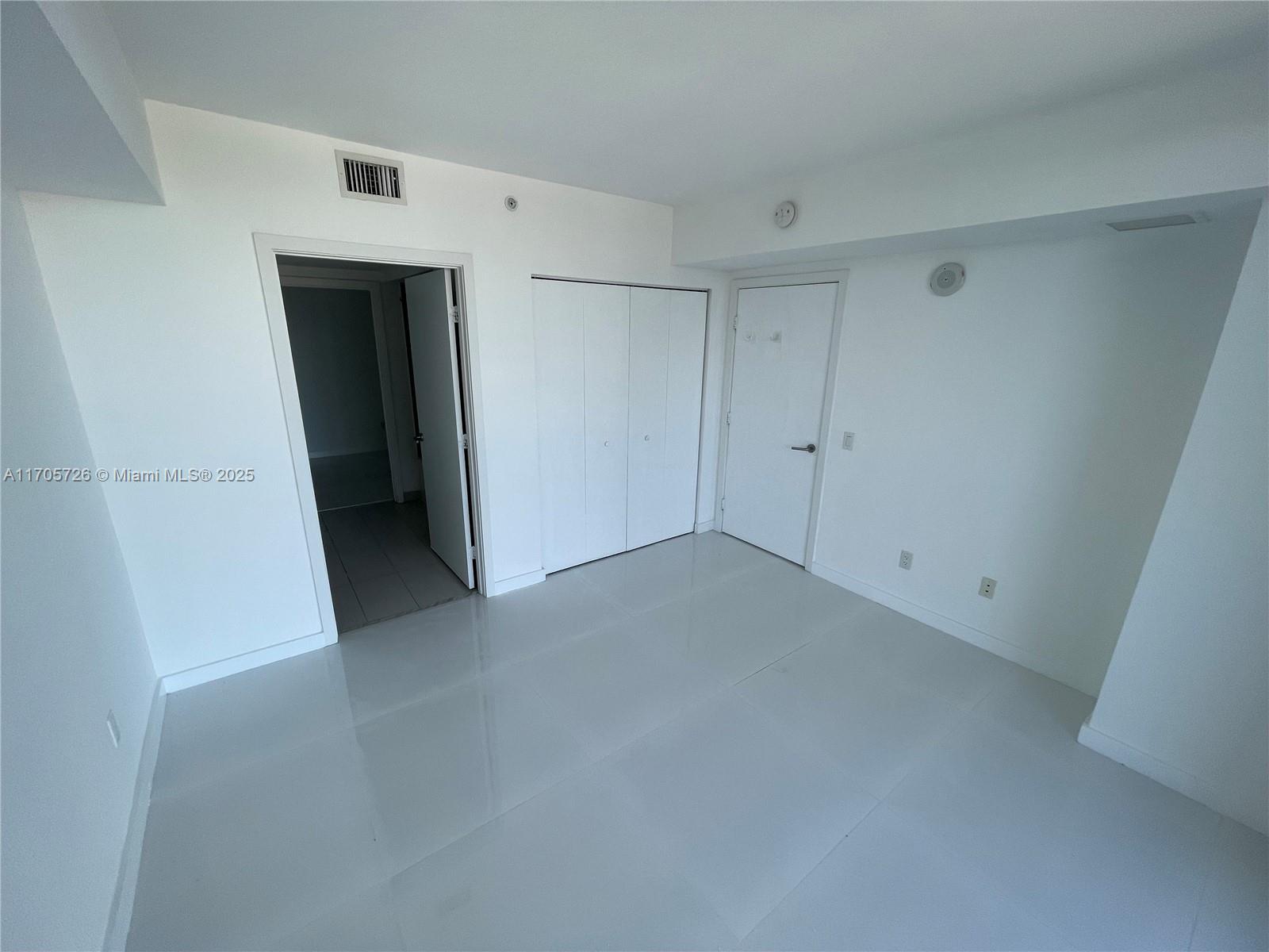 4250 Biscayne Boulevard, Unit 1104 Miami, FL 33137 - Photo 8 of 31 a view of a storage & utility room with a refrigerator