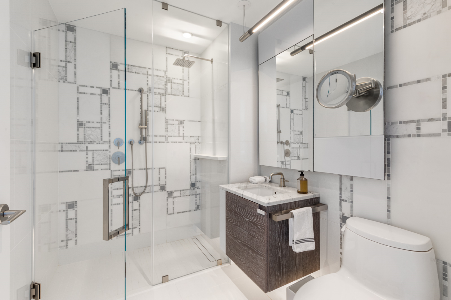 1 City Point, Unit PHE Brooklyn, NY 11201 - Photo 9 of 27 a bathroom with a granite countertop sink a toilet and shower