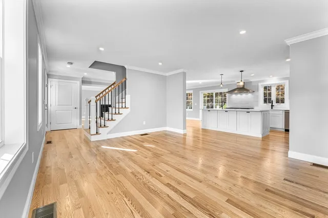 a view of kitchen dining table chairs microwave and cabinets