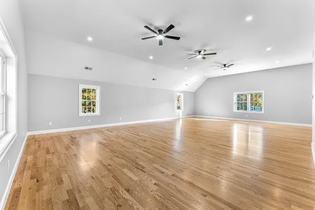 a spacious bathroom with a double vanity sink and mirror