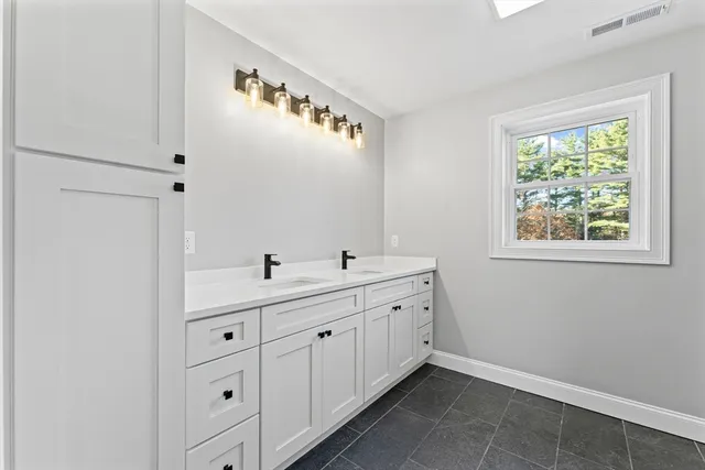 a view of room with window and cabinet