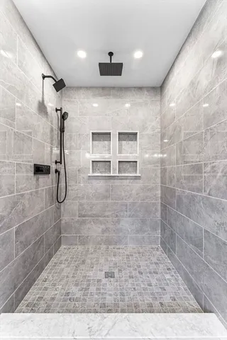 a kitchen with stainless steel appliances granite countertop a sink and stove