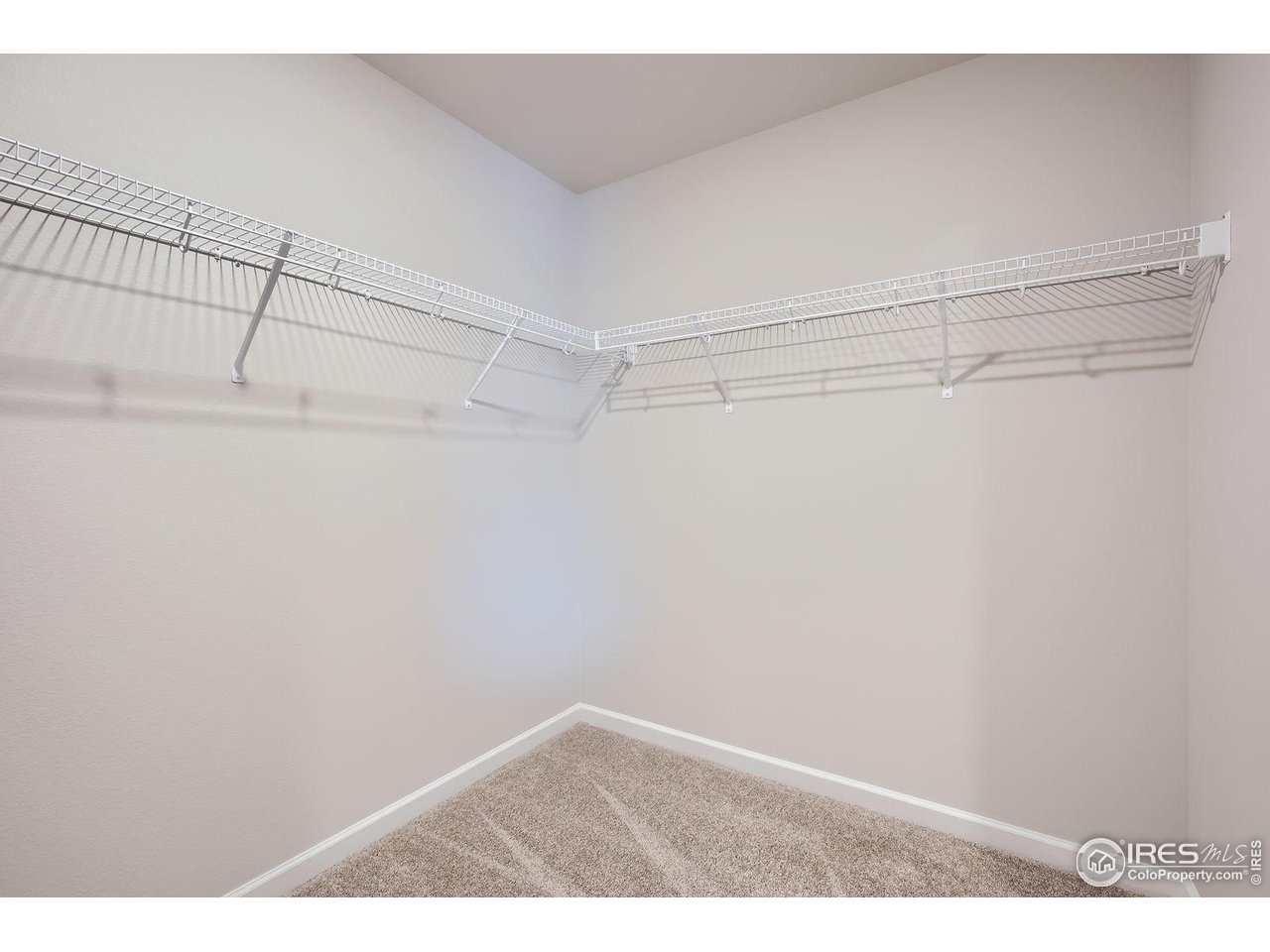 143 Robin Road Johnstown, CO 80534 - Photo 18 of 40 2nd Floor Primary Bedroom Closet