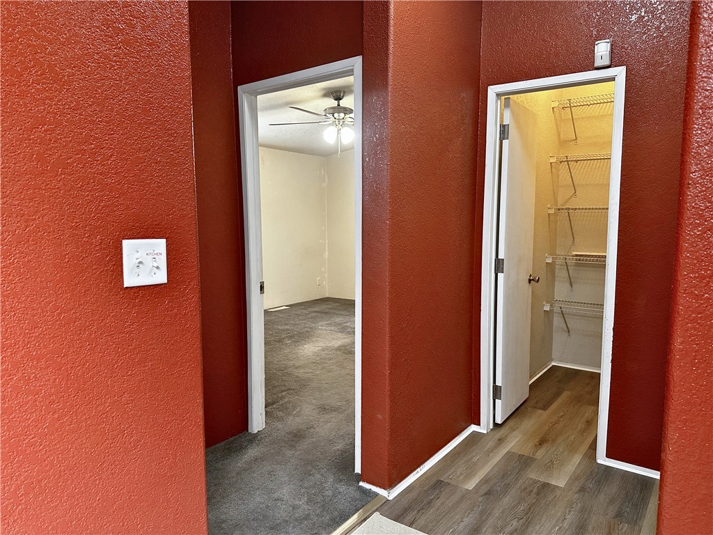 3746 Bouse Road Golden Valley, AZ 86413 - Photo 15 of 53 Hall with a textured wall and wood finished floors