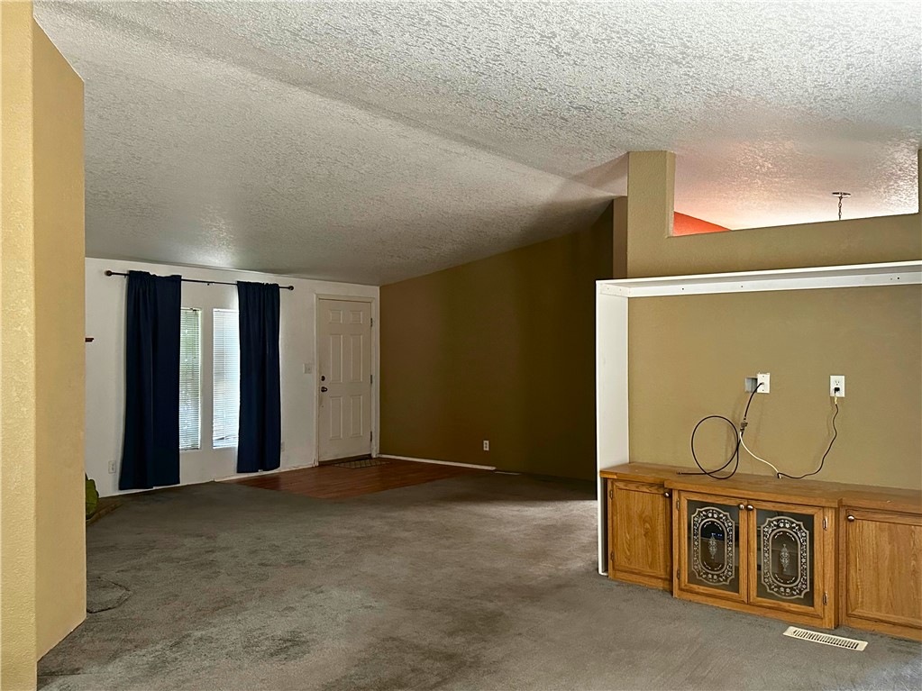 3746 Bouse Road Golden Valley, AZ 86413 - Photo 26 of 53 Bonus room with carpet and a textured ceiling