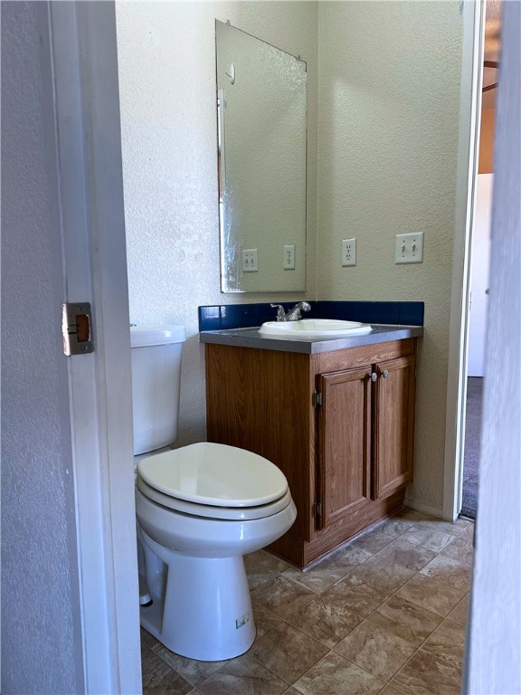 3746 Bouse Road Golden Valley, AZ 86413 - Photo 28 of 53 Bathroom featuring a textured wall and vanity
