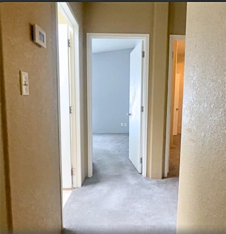 3746 Bouse Road Golden Valley, AZ 86413 - Photo 31 of 53 Hallway with a textured wall