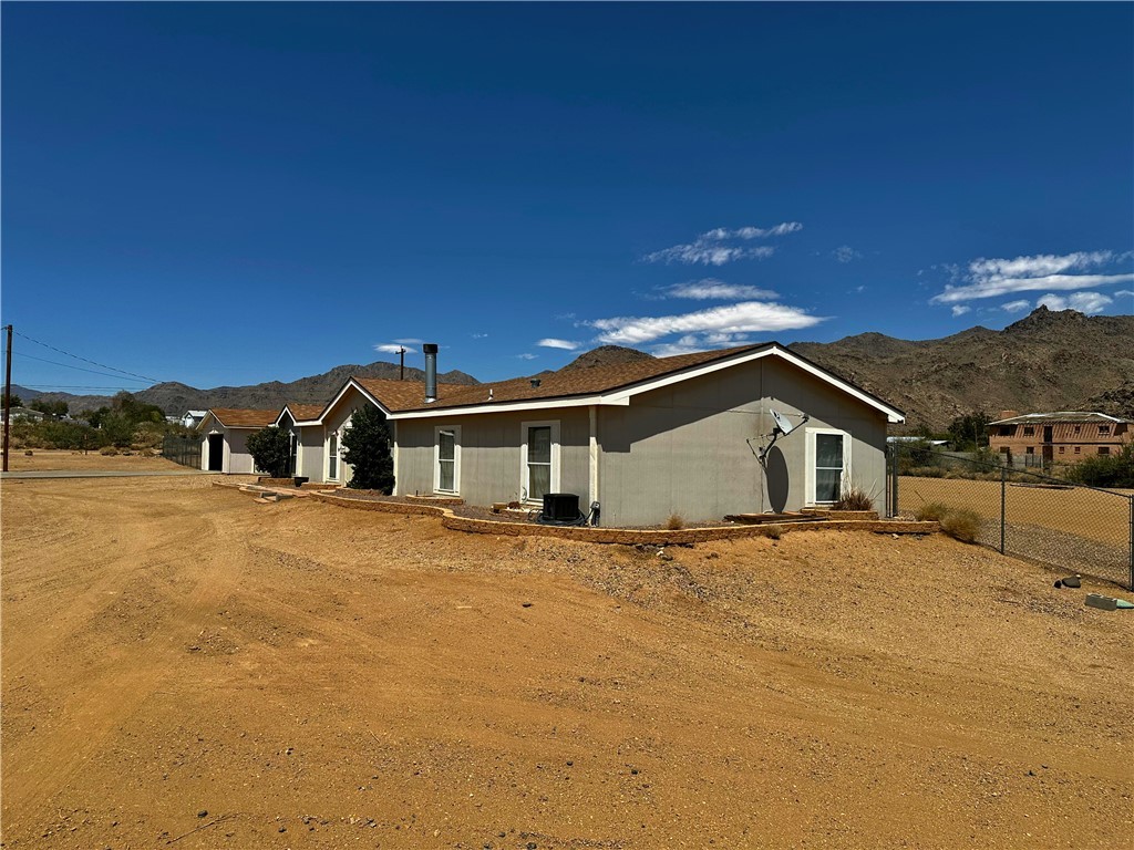 3746 Bouse Road Golden Valley, AZ 86413 - Photo 45 of 53 Back of property featuring a mountain view