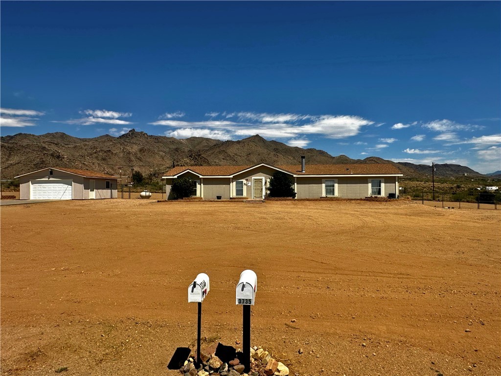 3746 Bouse Road Golden Valley, AZ 86413 - Photo 50 of 53 Ranch-style home featuring a garage and a mountain view