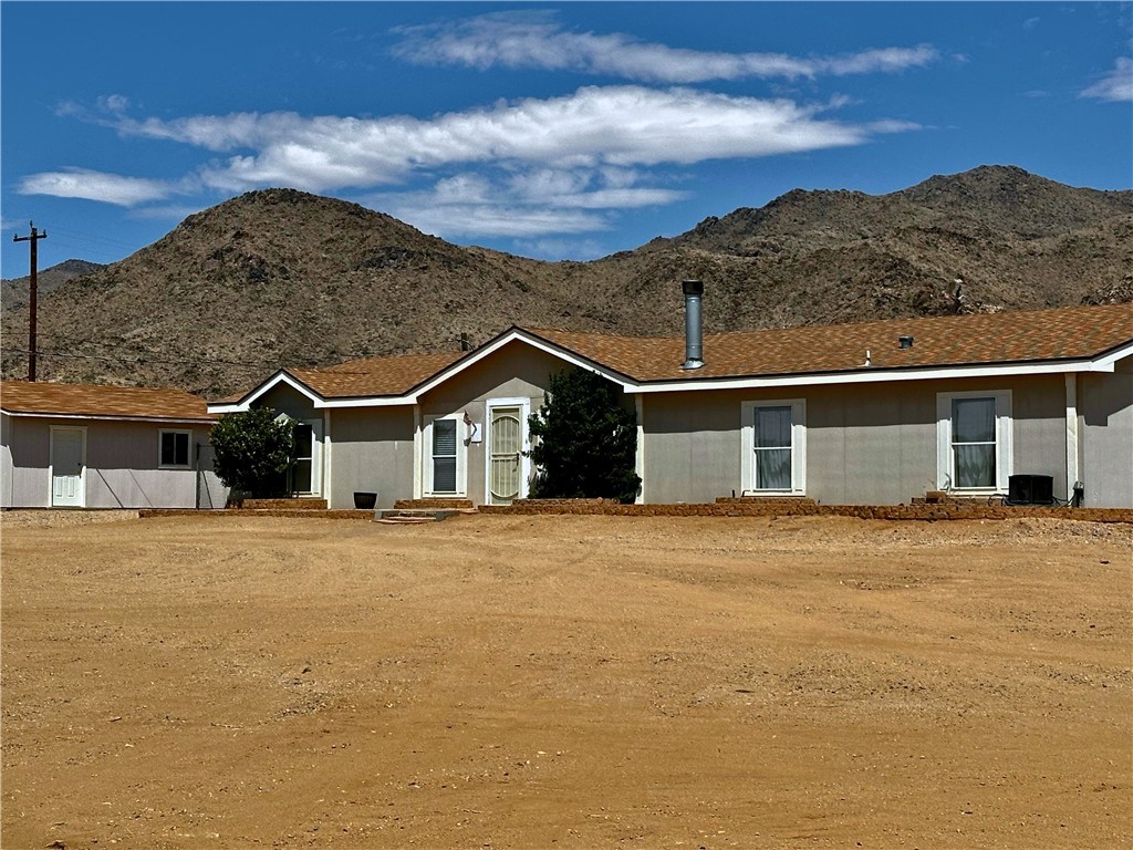 3746 Bouse Road Golden Valley, AZ 86413 - Photo 53 of 53 Rear view of property with a mountain view