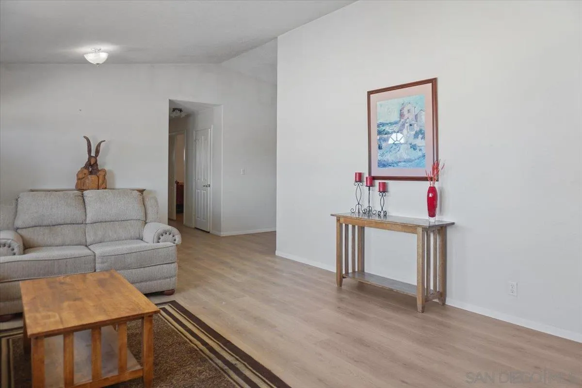 28525 Windy Pass Barstow, CA 92311 - Photo 12 of 40 a living room with furniture and a wooden floor