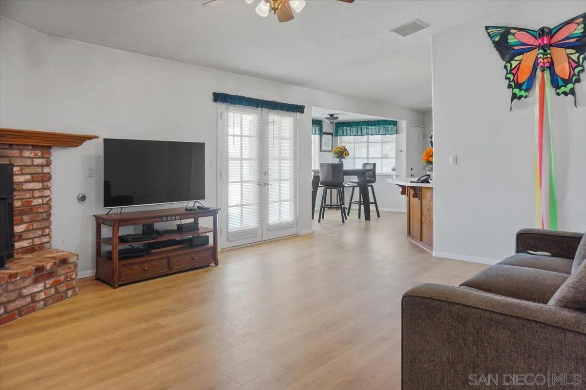 28525 Windy Pass Barstow, CA 92311 - Photo 15 of 40 a living room with furniture and a flat screen tv