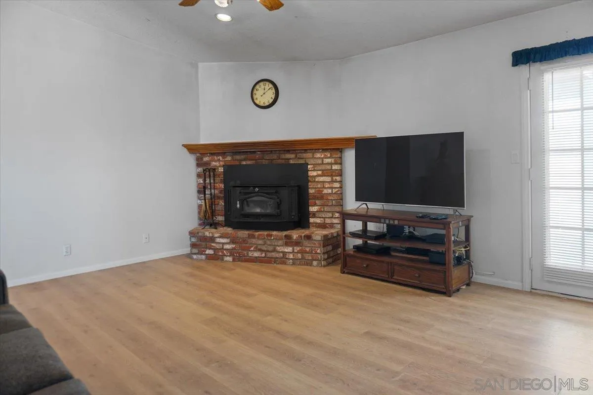 28525 Windy Pass Barstow, CA 92311 - Photo 16 of 40 a living room with furniture and a flat screen tv