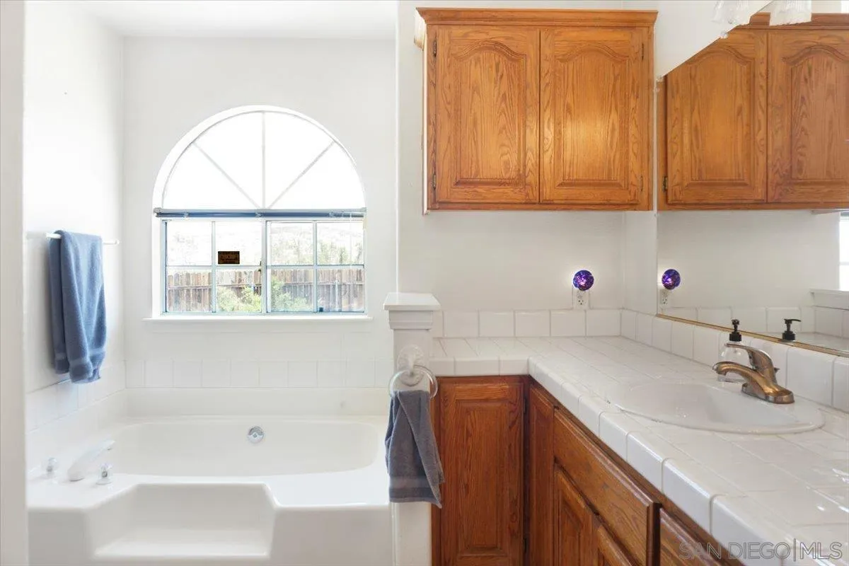 28525 Windy Pass Barstow, CA 92311 - Photo 20 of 40 a bathroom with a sink and a bathtub