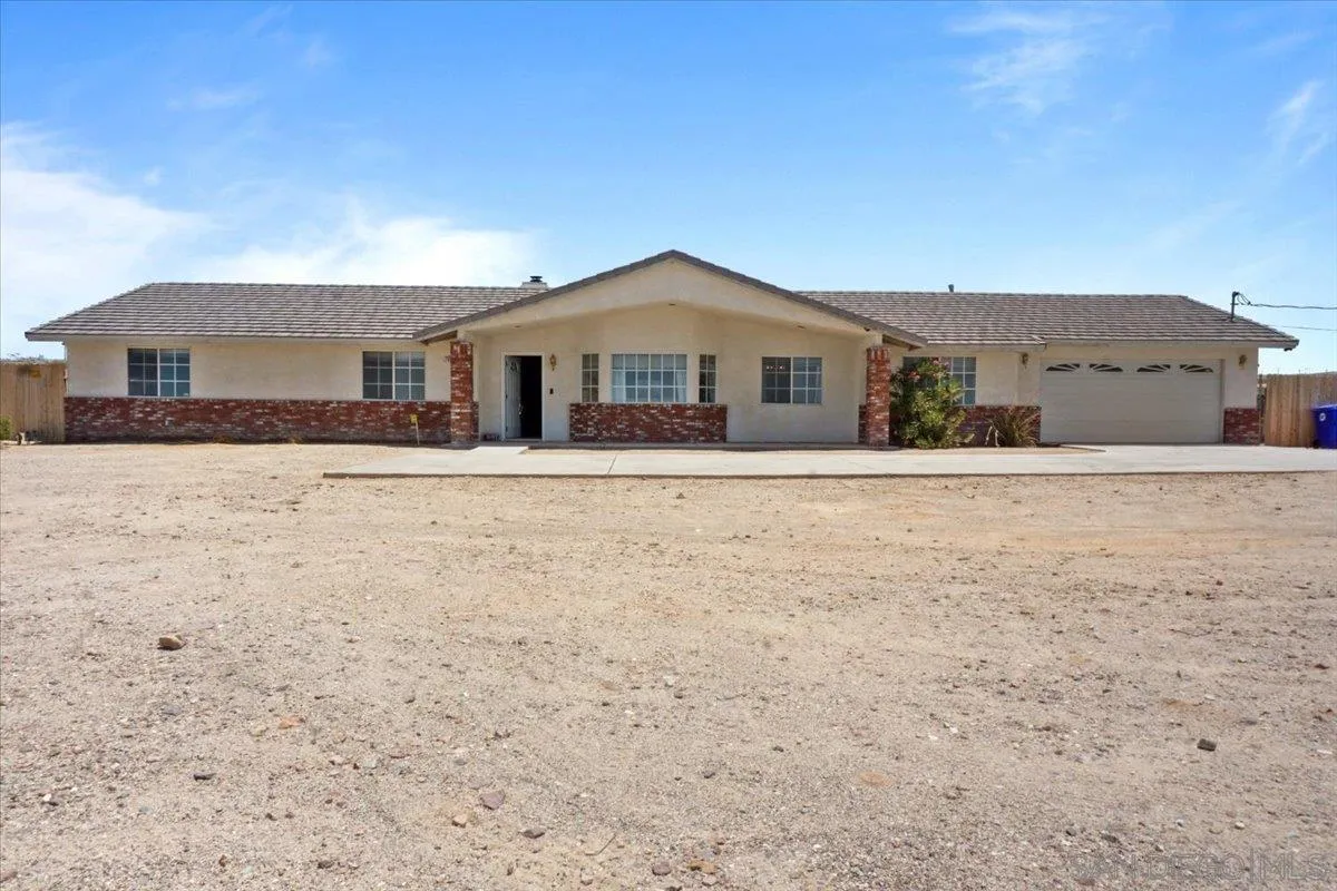 28525 Windy Pass Barstow, CA 92311 - Photo 2 of 40 a front view of a house with a yard