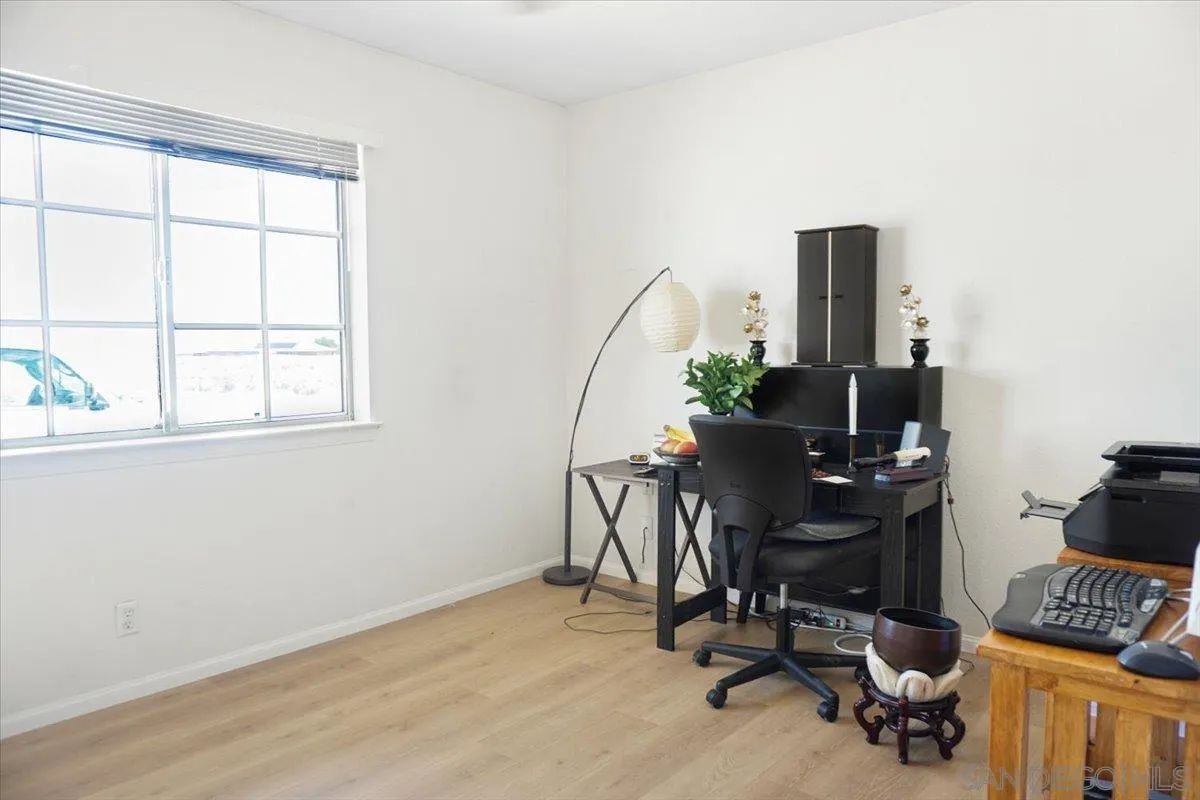28525 Windy Pass Barstow, CA 92311 - Photo 23 of 40 a view of a workspace with furniture and a window
