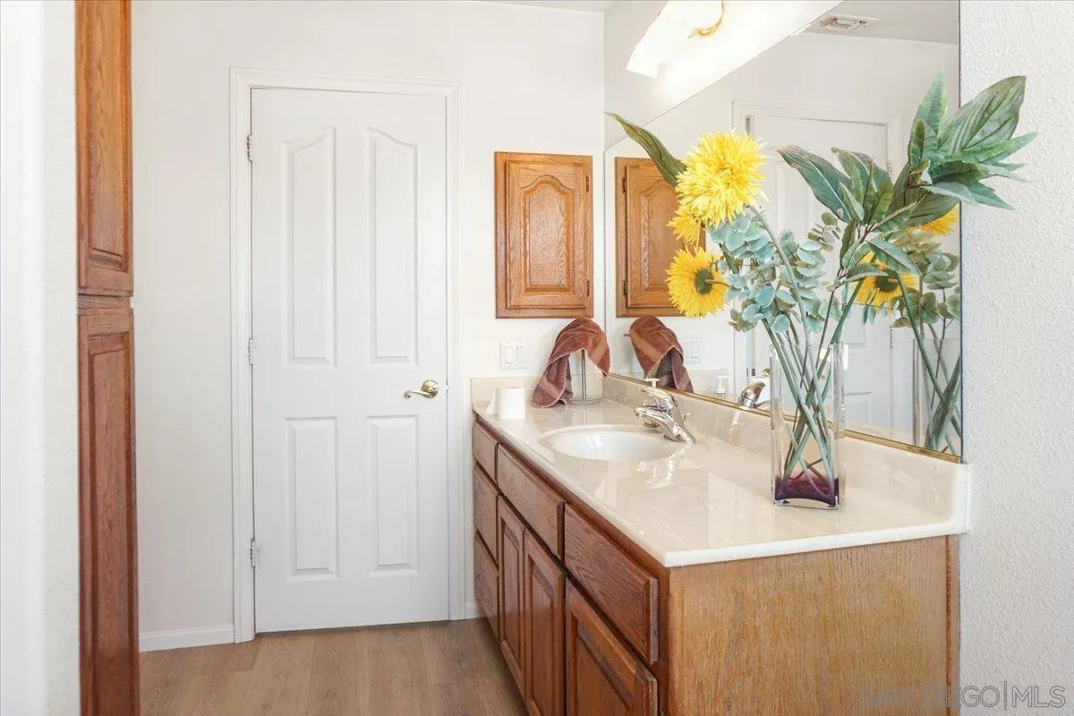 28525 Windy Pass Barstow, CA 92311 - Photo 26 of 40 a bathroom with a sink a vanity and a mirror