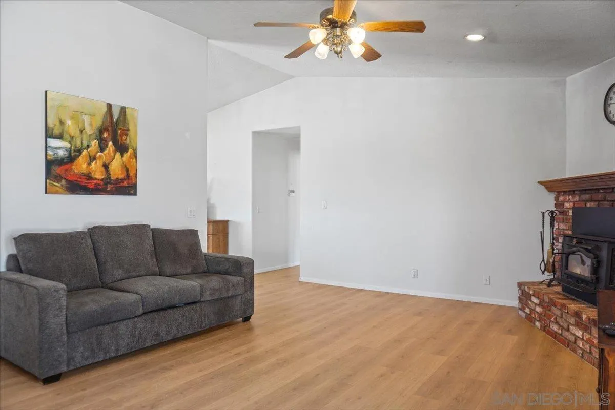 28525 Windy Pass Barstow, CA 92311 - Photo 35 of 40 a living room with furniture and a flat screen tv
