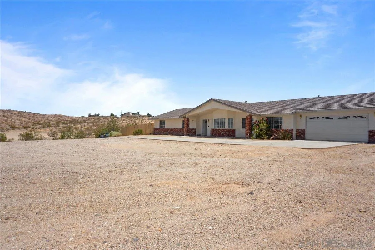 28525 Windy Pass Barstow, CA 92311 - Photo 40 of 40 a front view of a house with a yard