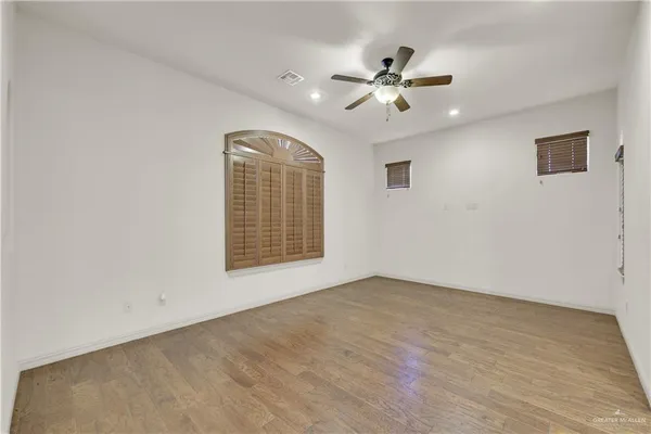 a view of an empty room with a window