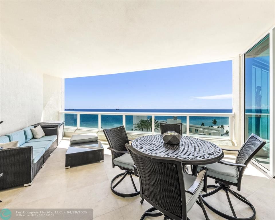 101 South Fort Lauderdale Beach Boulevard, Unit 1104 Fort Lauderdale, FL 33316 - Photo 1 of 41 a view of a patio with a table and chairs