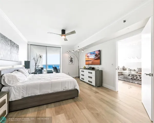 a bedroom with bed and window